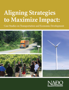 Report cover with truck driving on rural road, group of individuals at a groundbreaking ceremony, and a wind turbine in an open field.