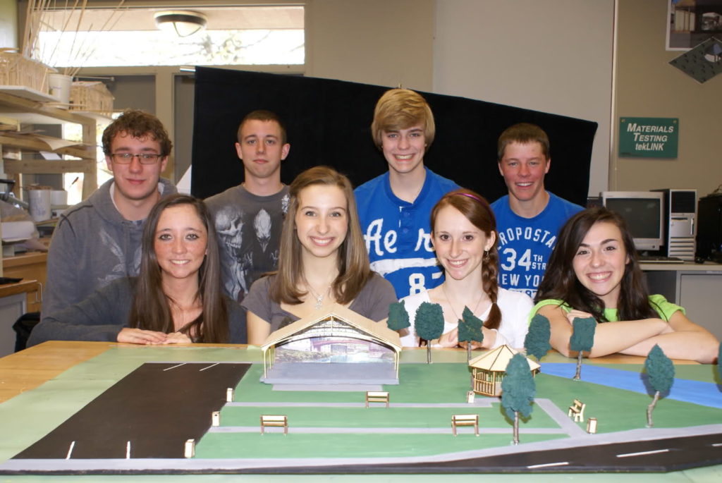 Members of the Students in Action team with the model of the park and stage. (Photo credit: SIA team)