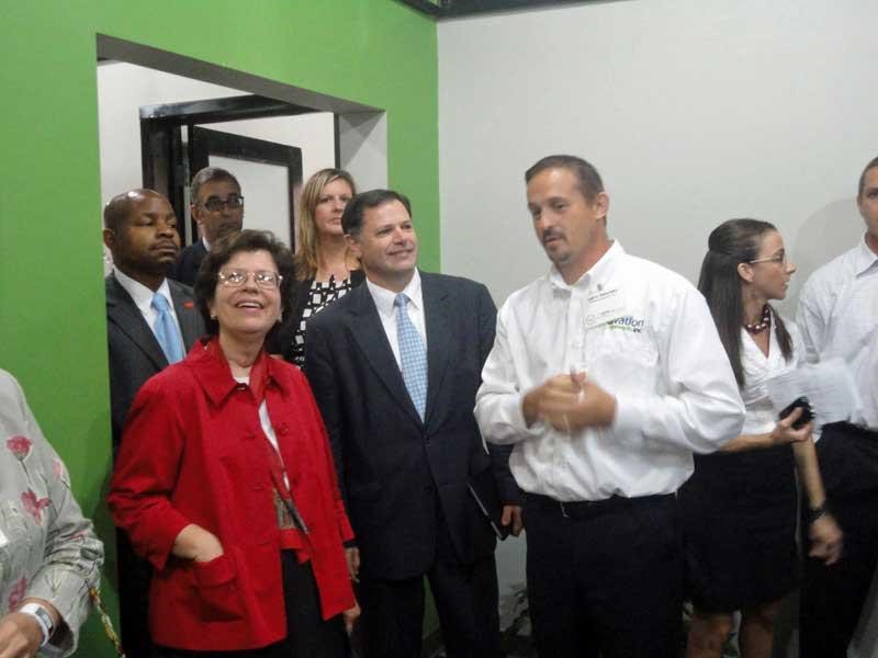 Department of Commerce officials visiting a company facility