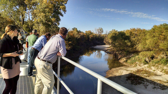 Workshop participants toured water infrastructure projects throughout the region. Here, looking out onto the Little Arkansas River while visiting the Aquifer Storage and Recovery program. Little Arkansas