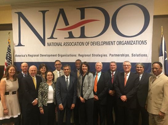 NADO 2015-2016 Executive Committee and EDA Leadership at the ATC, left to right: Angela Belden Martinez, EDA Denver; Kevin Byrd, New River Valley Regional Commission (VA); Scott Koons, North Central Florida RPC; Linda Cruz-Carnall, EDA Philadelphia; Jeannette Tamayo, EDA Chicago; Doug Elliott, East Central Iowa COG; Tom Guevara, EDA Deputy Assistant Secretary for Regional Affairs; Jay Williams, Assistant Secretary; Lynne Keller Forbes, South Eastern COG (SD); Jeff Kiely, Northwest New Mexico COG; Terry Bobrowski, East Tennessee Development District; Philip Paradice, EDA Atlanta; Jorge Ayala, EDA Austin; and Leonard Smith, EDA Seattle.