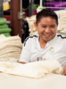 Smiling man working in textile production